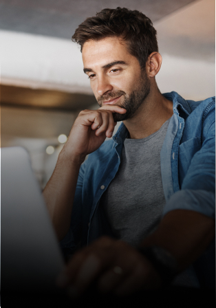 A man looking at a laptop